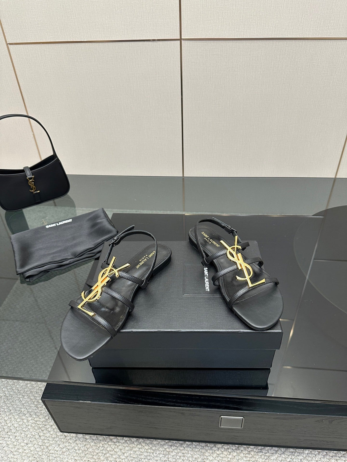BLACK STRAPPY FLAT SANDALS WITH GOLD LOGO DETAIL