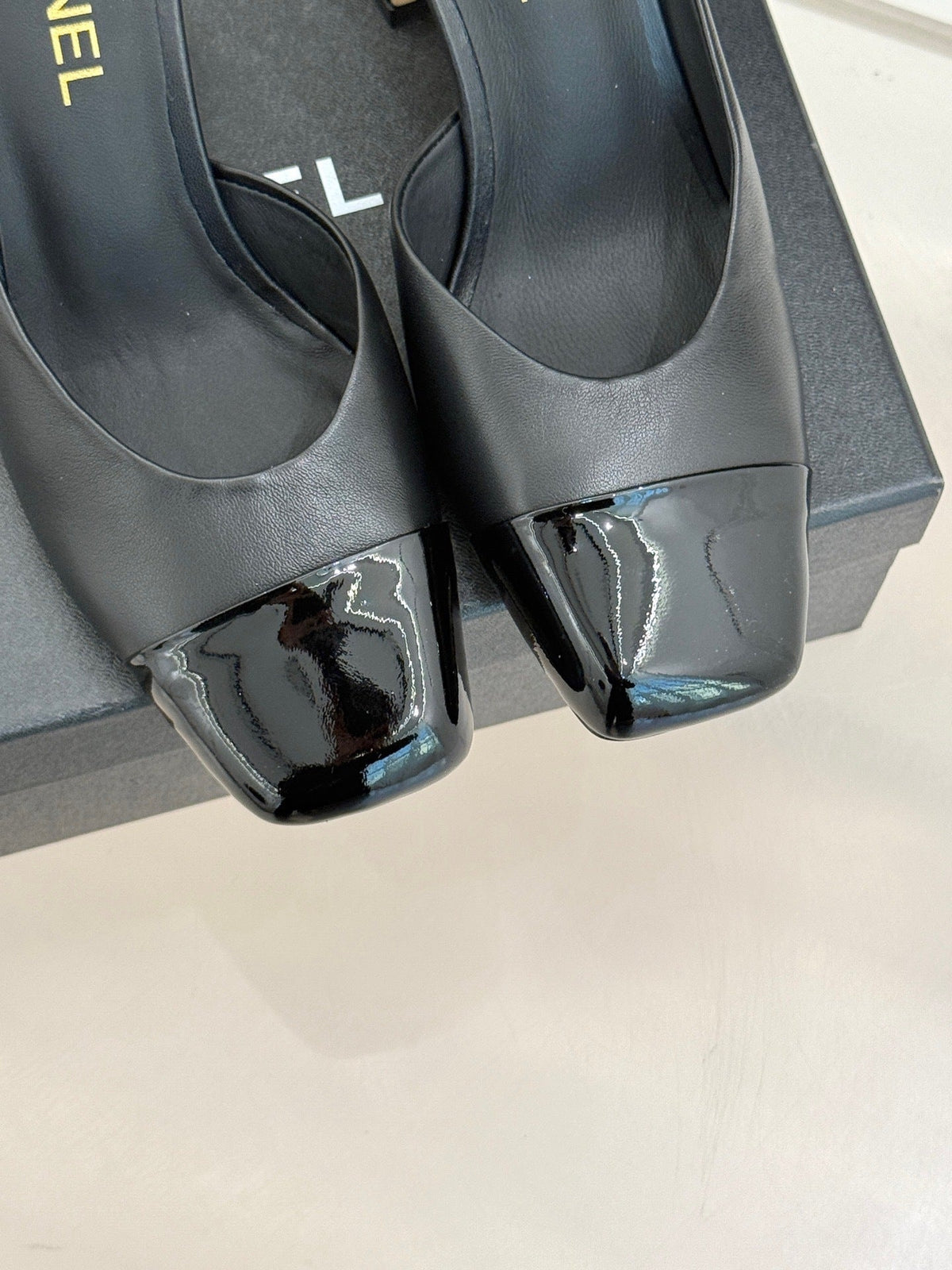 BLACK LEATHER CAP-TOE MULE HEELS WITH GOLD DETAIL