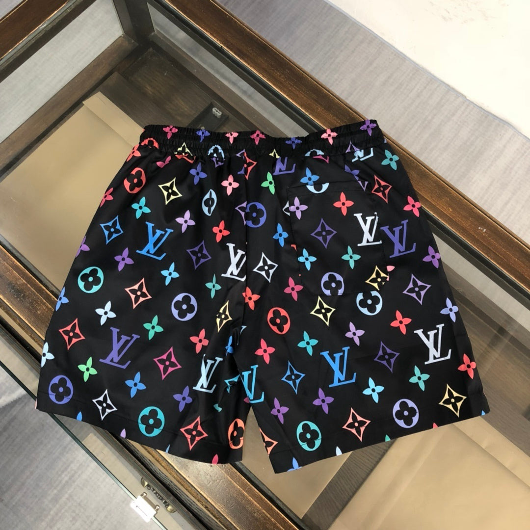 BLACK MULTICOLOR PRINT SWIM SHORTS
