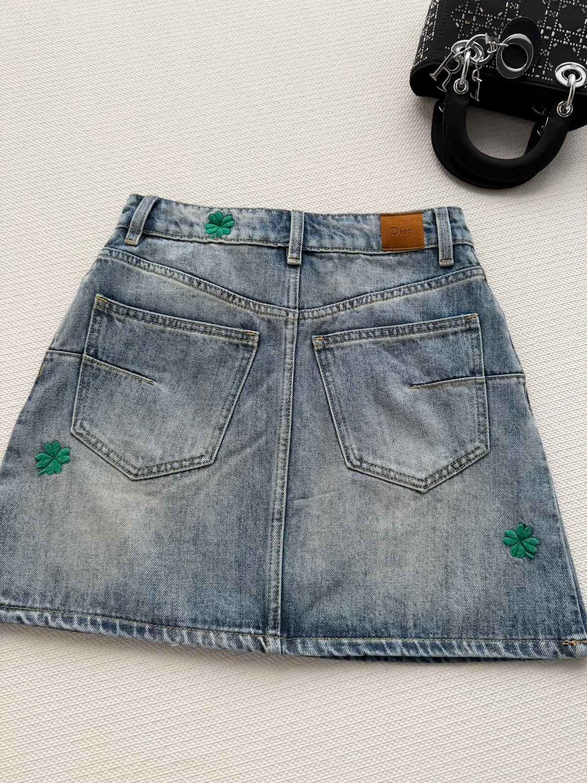 BLUE DENIM MINI SKIRT WITH FLORAL EMBROIDERY