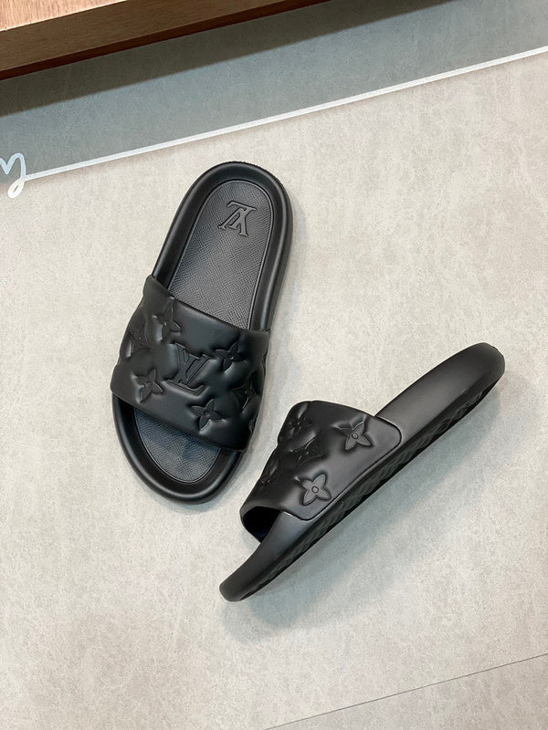 BLACK EMBOSSED MONOGRAM RUBBER SLIDE SANDALS