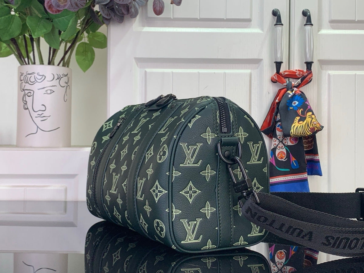 SPORTY BARREL CROSSBODY BAG