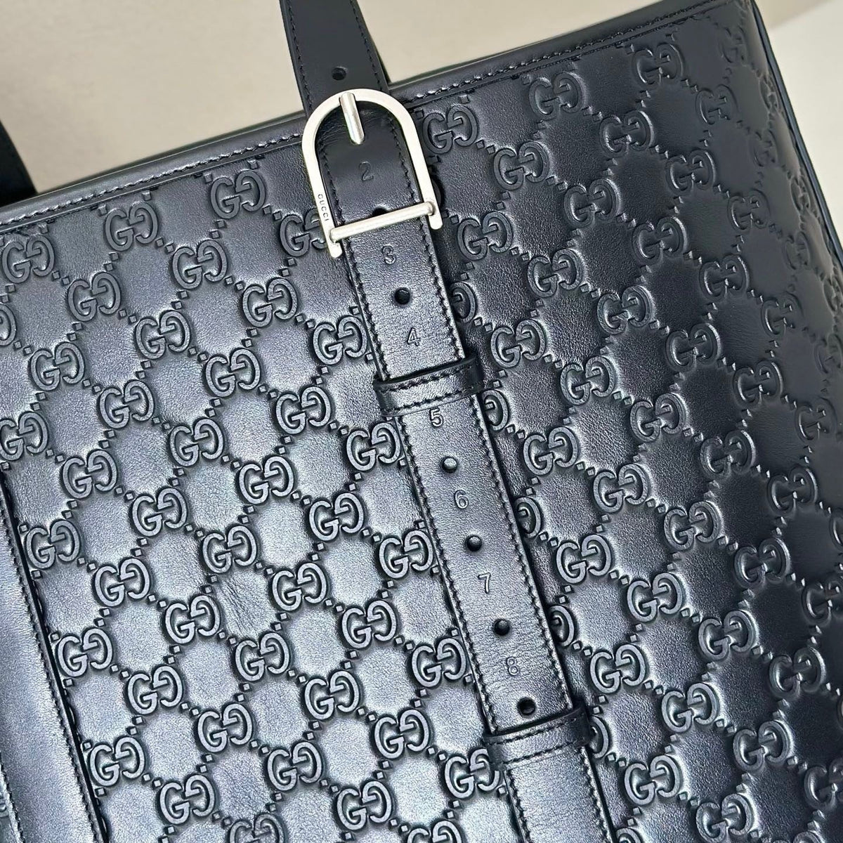 EMBOSSED LEATHER TOTE BAG