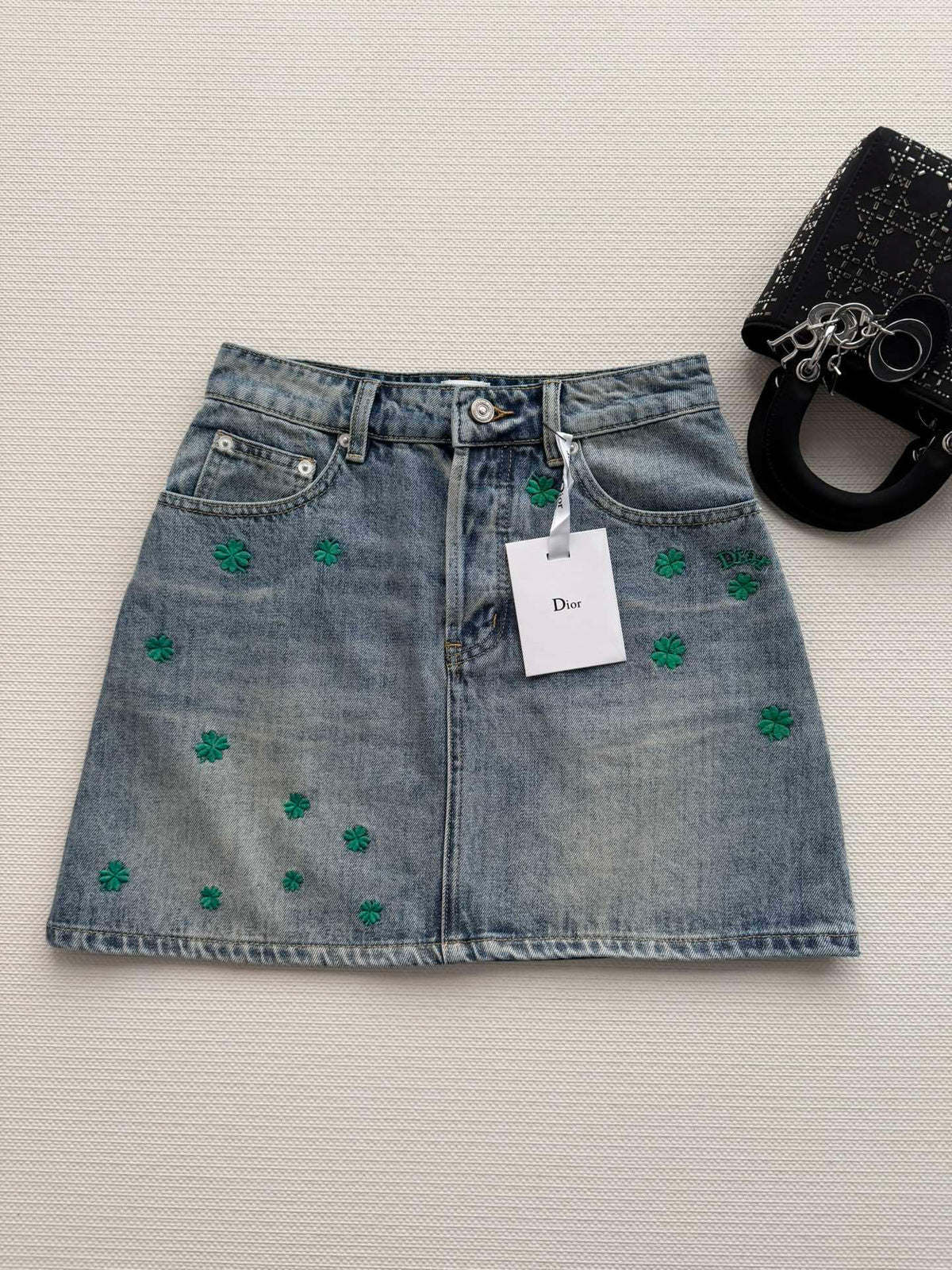 BLUE DENIM MINI SKIRT WITH FLORAL EMBROIDERY