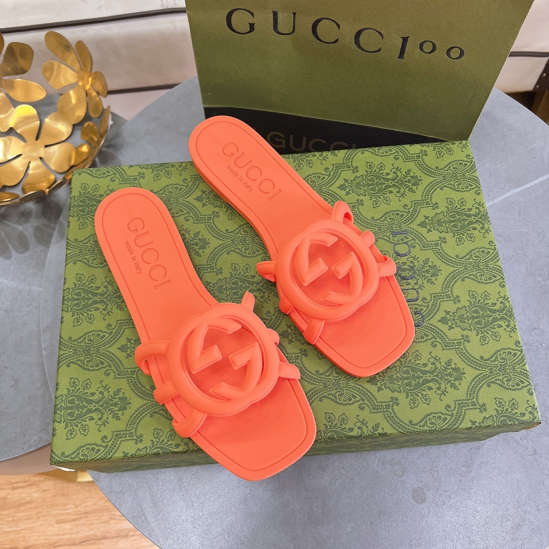 NEON ORANGE RUBBER SLIDE SANDALS WITH ROUND EMBLEM