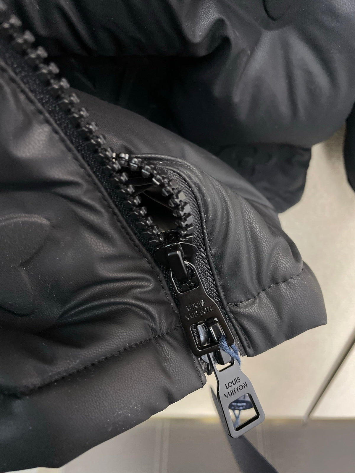 PUFFER JACKET WITH EMBOSSED GEOMETRIC PATTERN