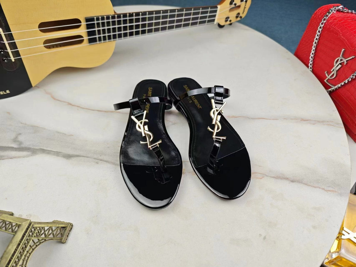 BLACK SLIDE SANDALS WITH GOLD DETAIL