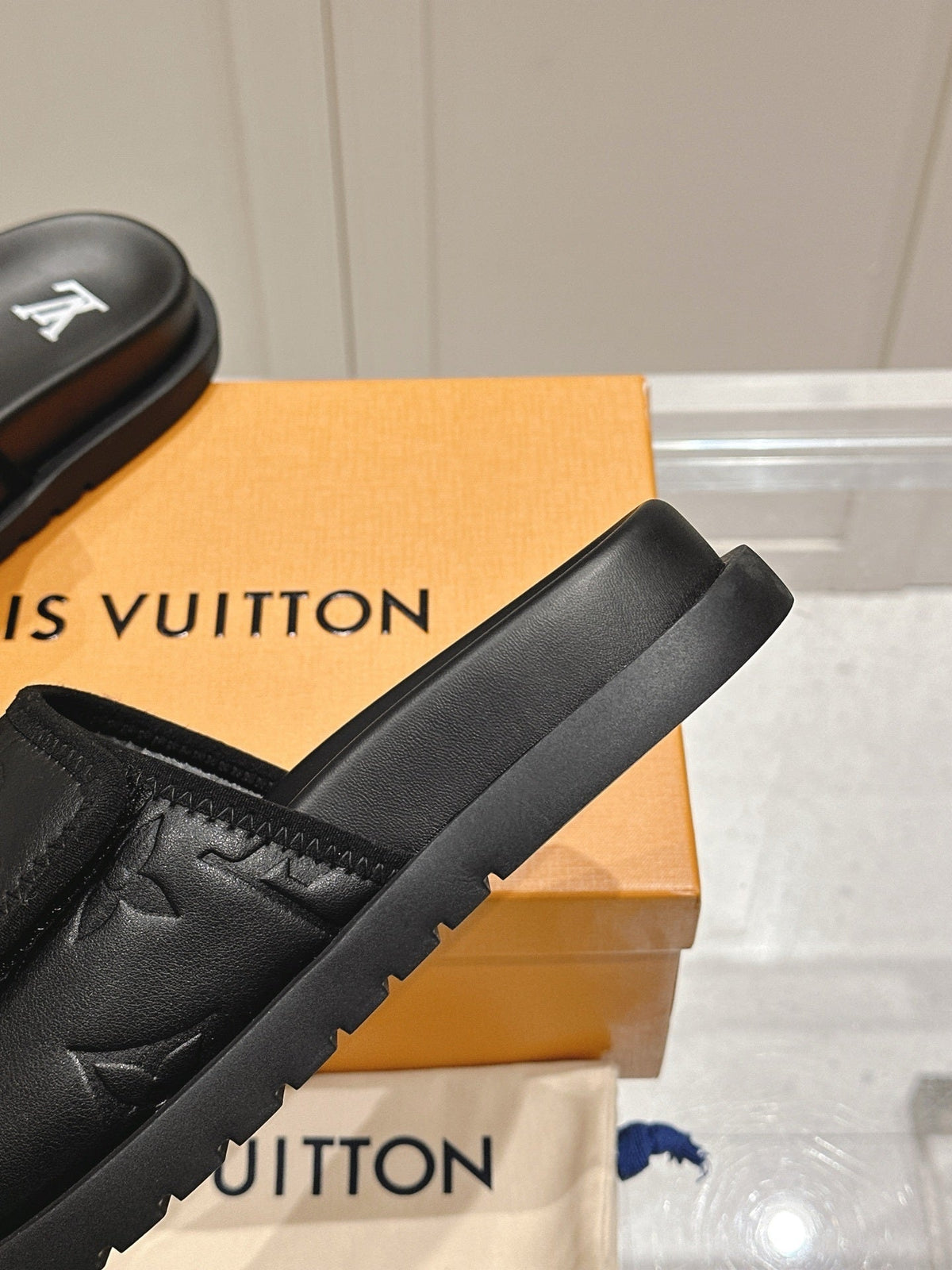 BLACK EMBOSSED SLIDE SANDALS