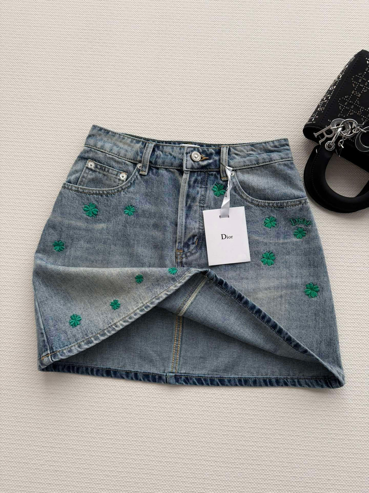 BLUE DENIM MINI SKIRT WITH FLORAL EMBROIDERY