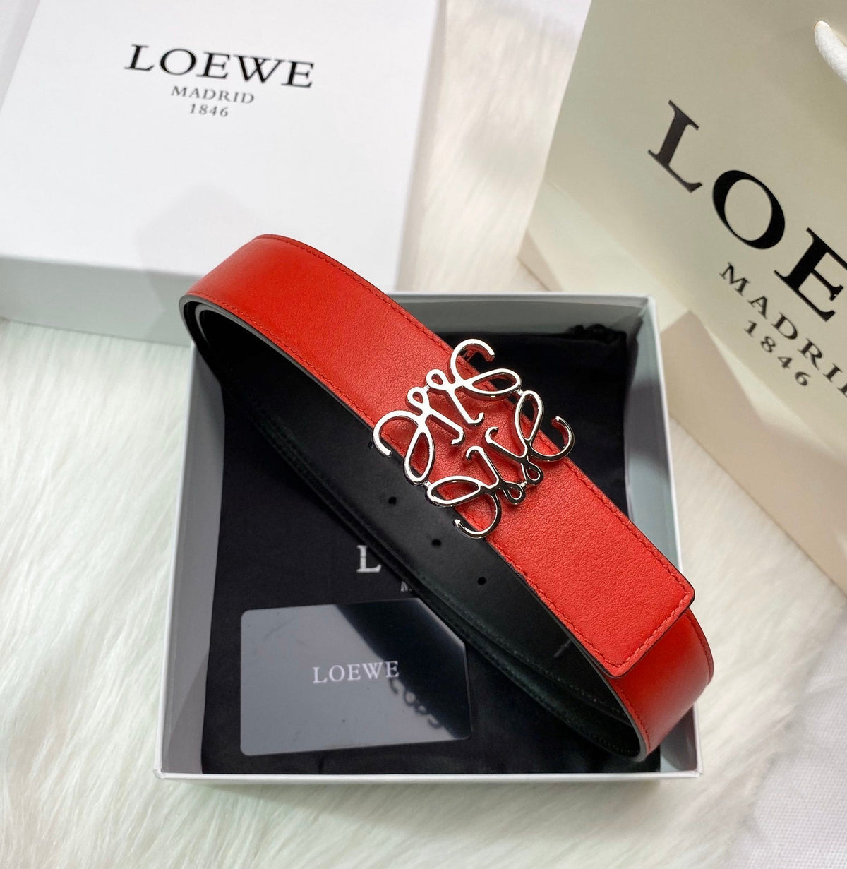 RED LEATHER BELT WITH SILVER ANAGRAM BUCKLE