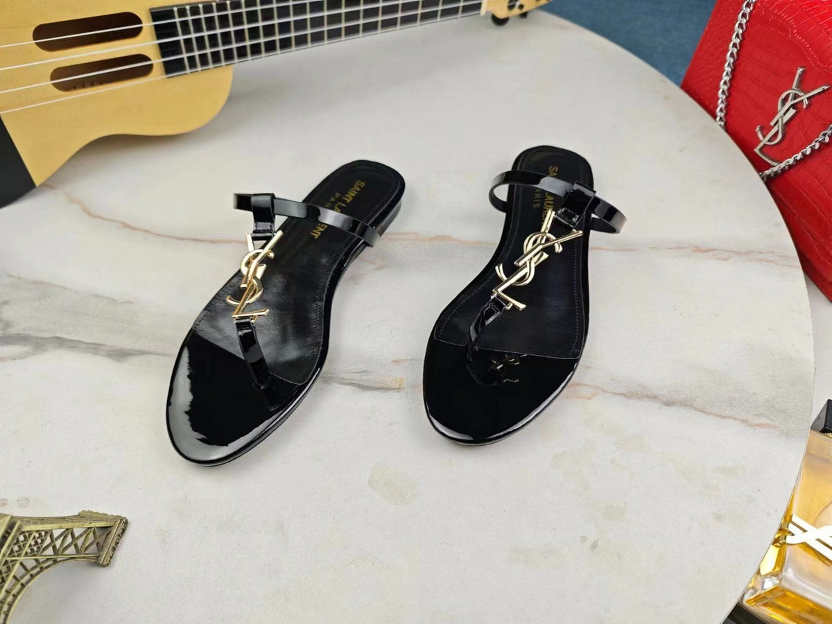 BLACK SLIDE SANDALS WITH GOLD DETAIL