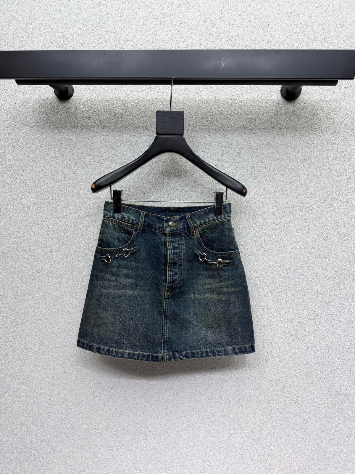 DARK BLUE DENIM MINI SKIRT WITH METAL DETAIL
