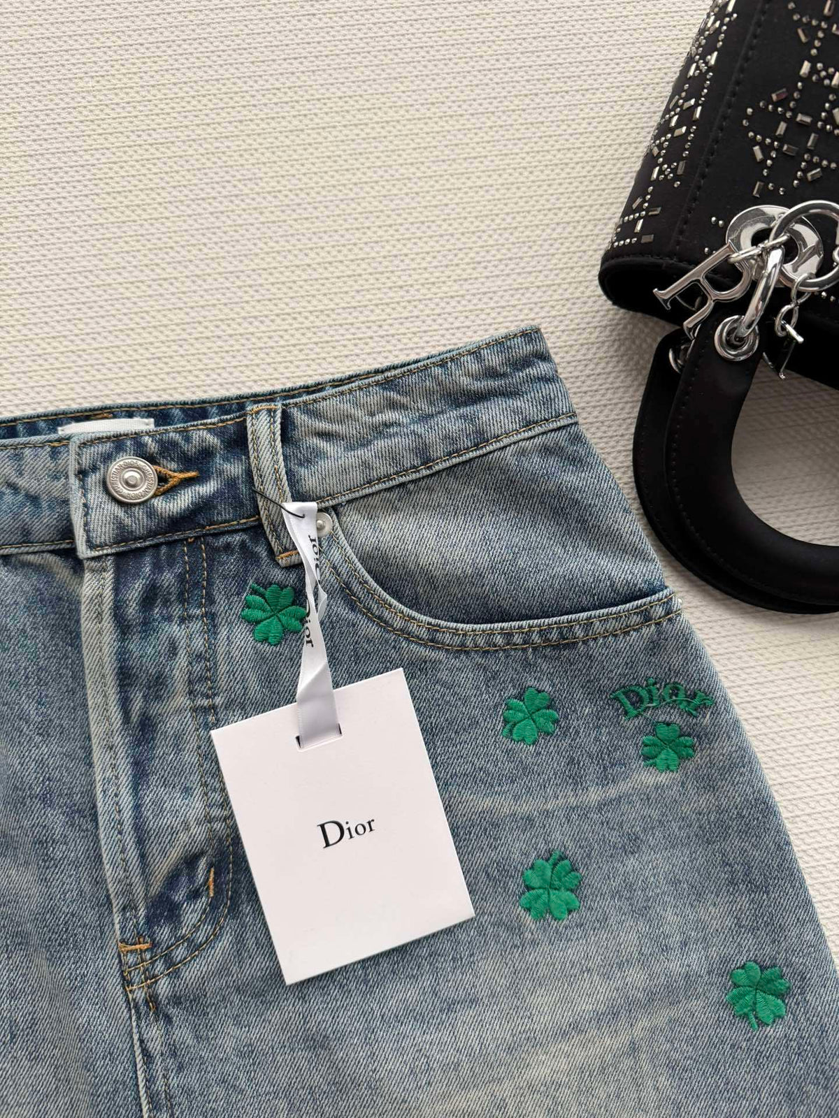 BLUE DENIM MINI SKIRT WITH FLORAL EMBROIDERY
