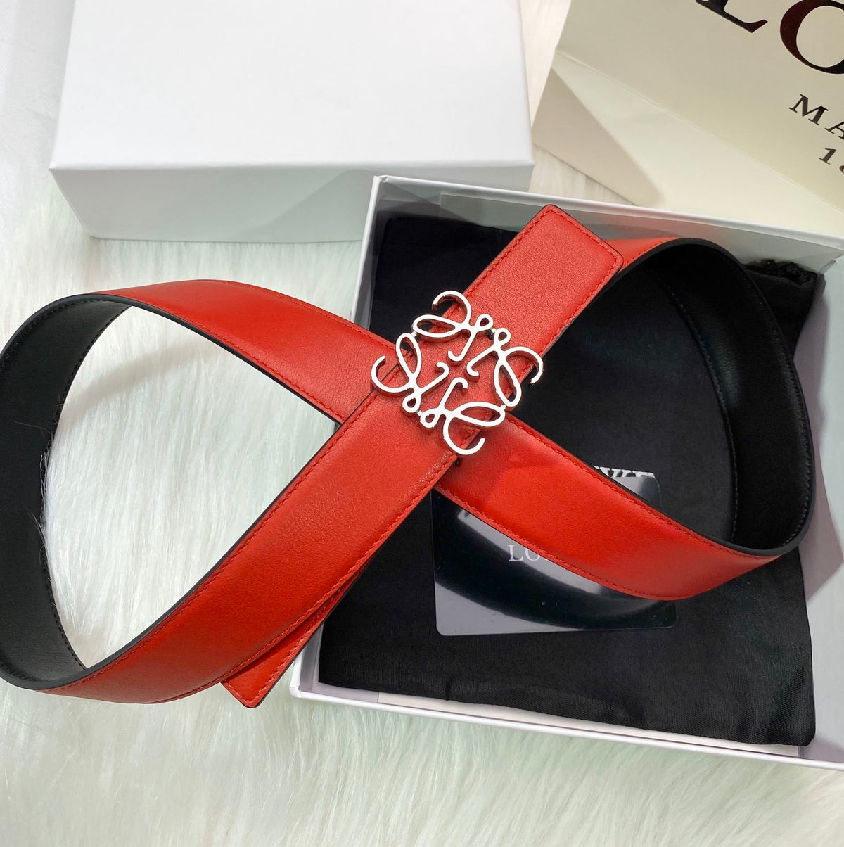 RED LEATHER BELT WITH SILVER ANAGRAM BUCKLE
