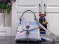 IRIDESCENT EMBOSSED TOP-HANDLE BAG