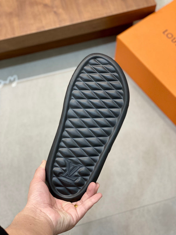 BLACK EMBOSSED MONOGRAM RUBBER SLIDE SANDALS