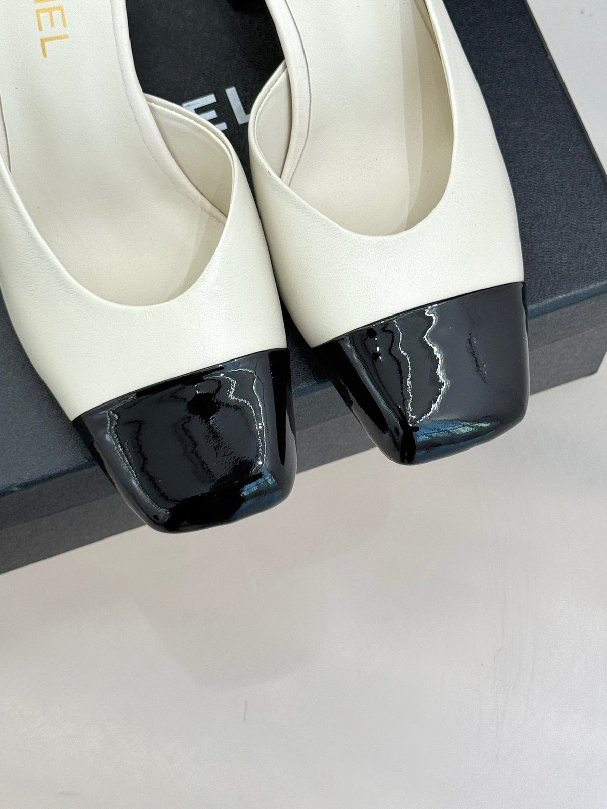 IVORY & BLACK TWO-TONE CAP-TOE MULE HEELS