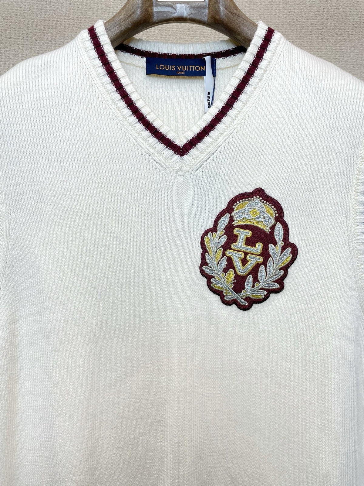 V-NECK KNIT VEST WITH EMBROIDERED CREST