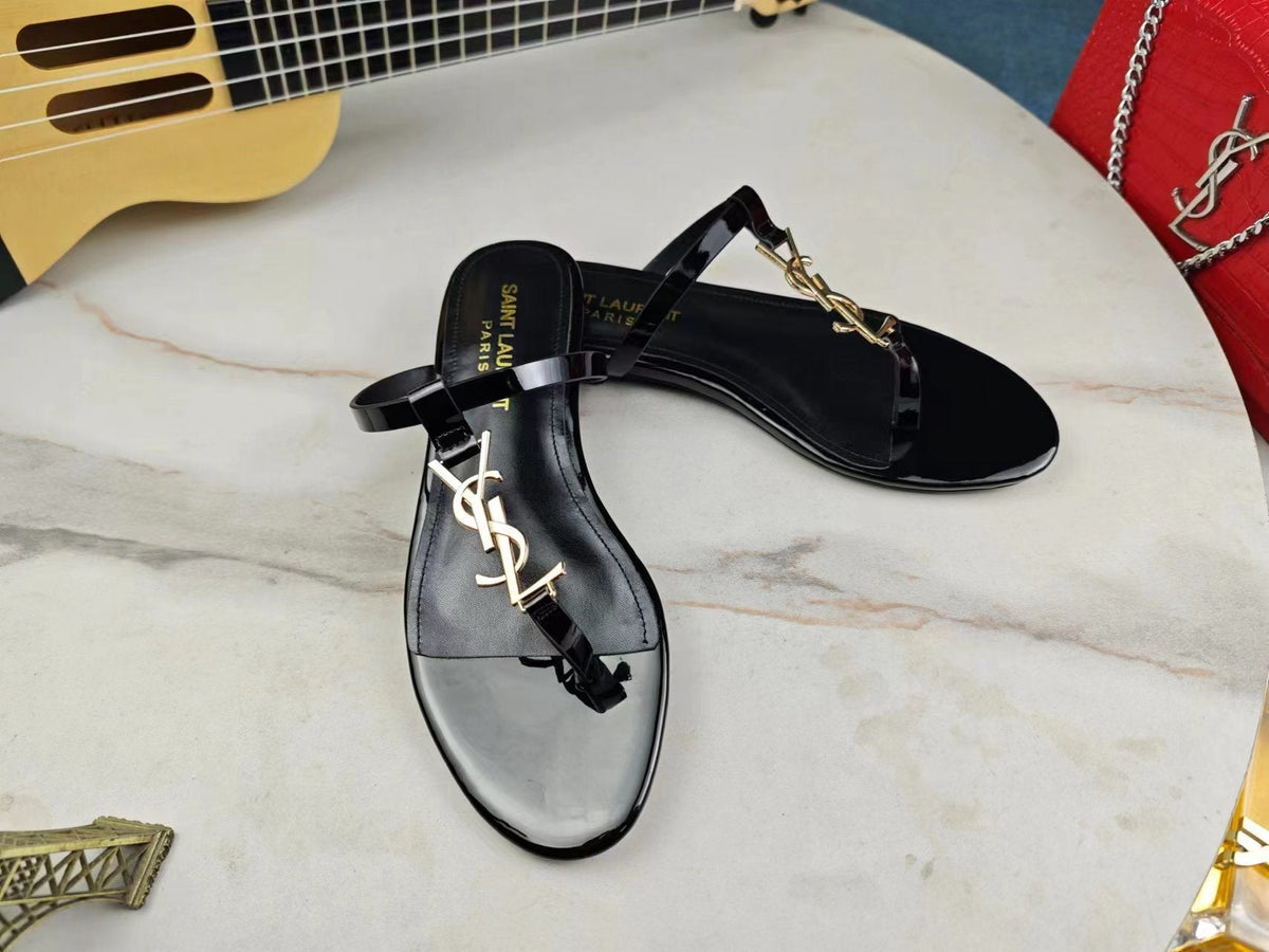 BLACK SLIDE SANDALS WITH GOLD DETAIL