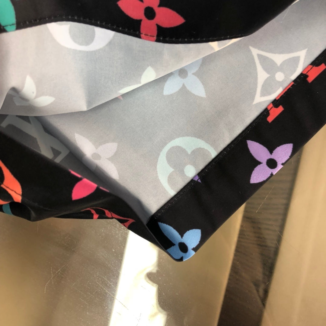 BLACK MULTICOLOR PRINT SWIM SHORTS