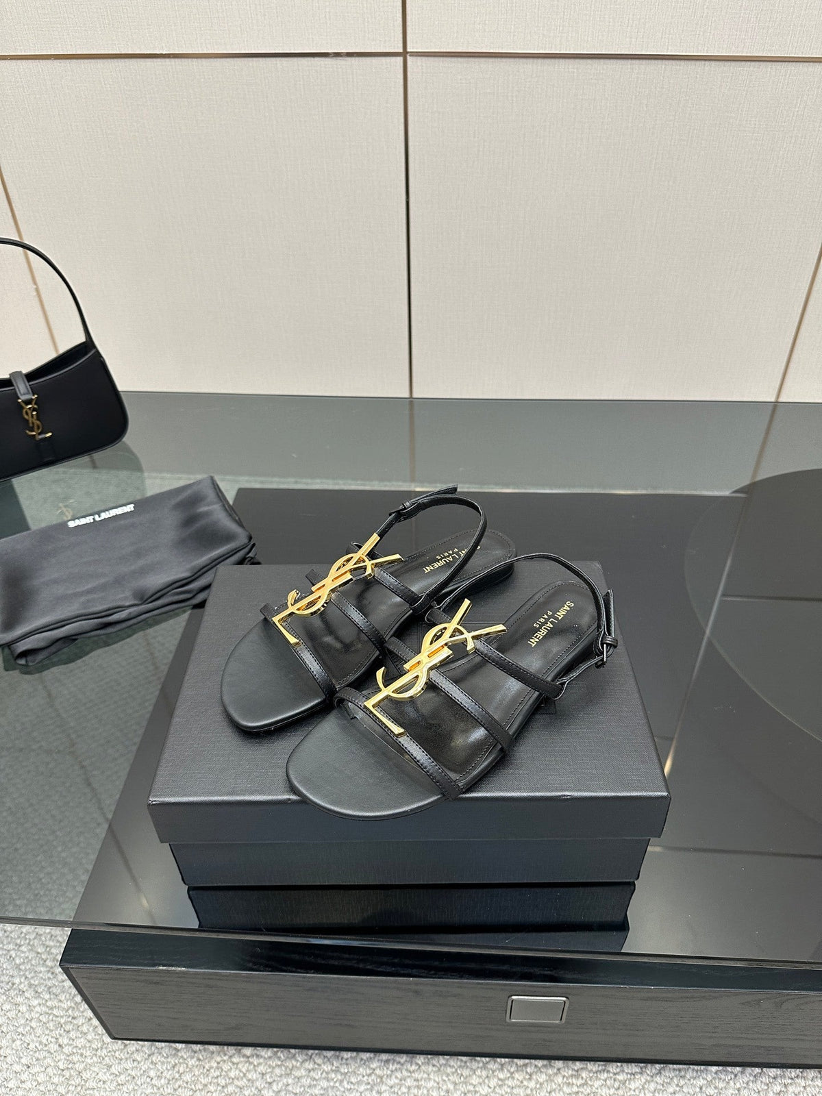 BLACK STRAPPY FLAT SANDALS WITH GOLD LOGO DETAIL
