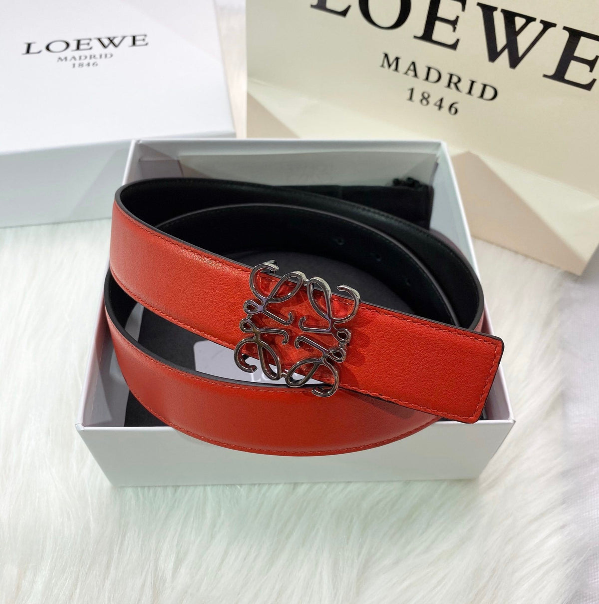 RED LEATHER BELT WITH SILVER ANAGRAM BUCKLE