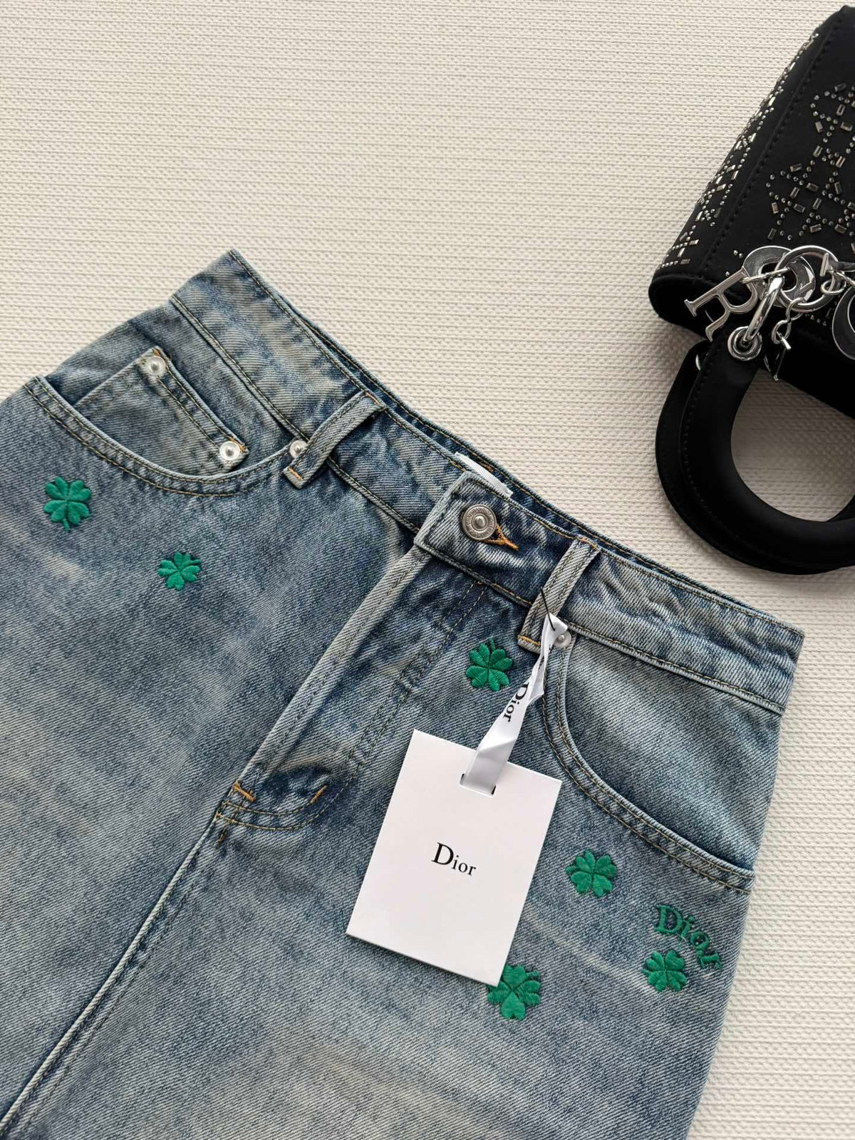 BLUE DENIM MINI SKIRT WITH FLORAL EMBROIDERY
