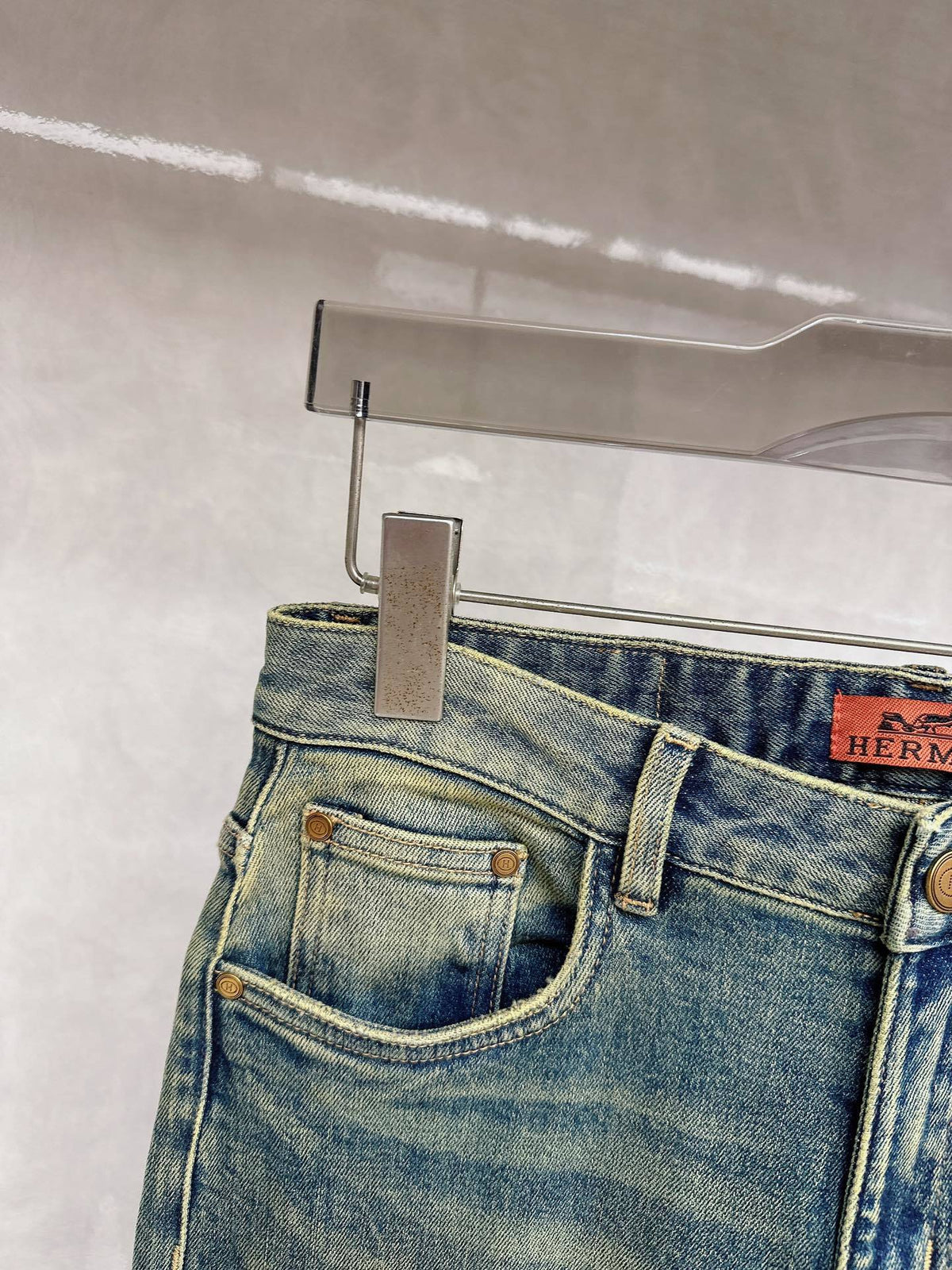 DISTRESSED DENIM JEANS WITH GRAPHIC BACK POCKET