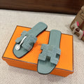SOFT GREEN SUEDE SLIDE SANDALS