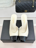 IVORY & BLACK TWO-TONE CAP-TOE MULE HEELS