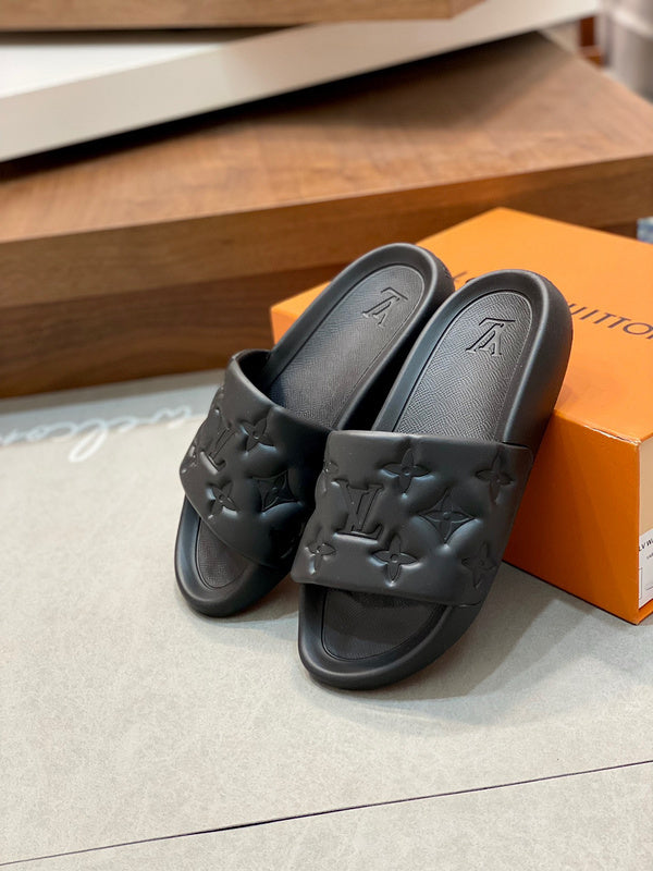 BLACK EMBOSSED MONOGRAM RUBBER SLIDE SANDALS