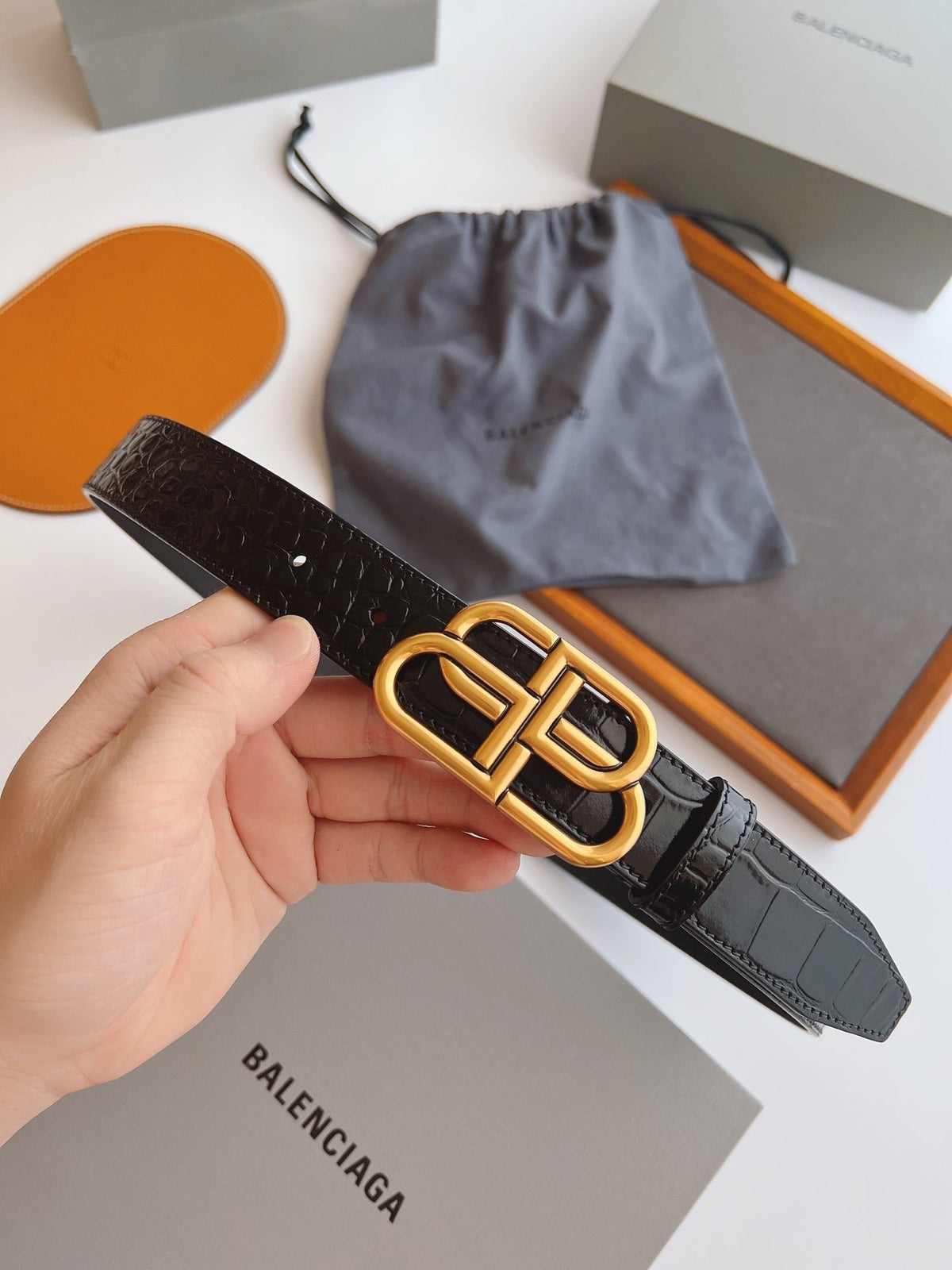 EMBOSSED BLACK LEATHER BELT WITH GOLD-TONE LOGO BUCKLE