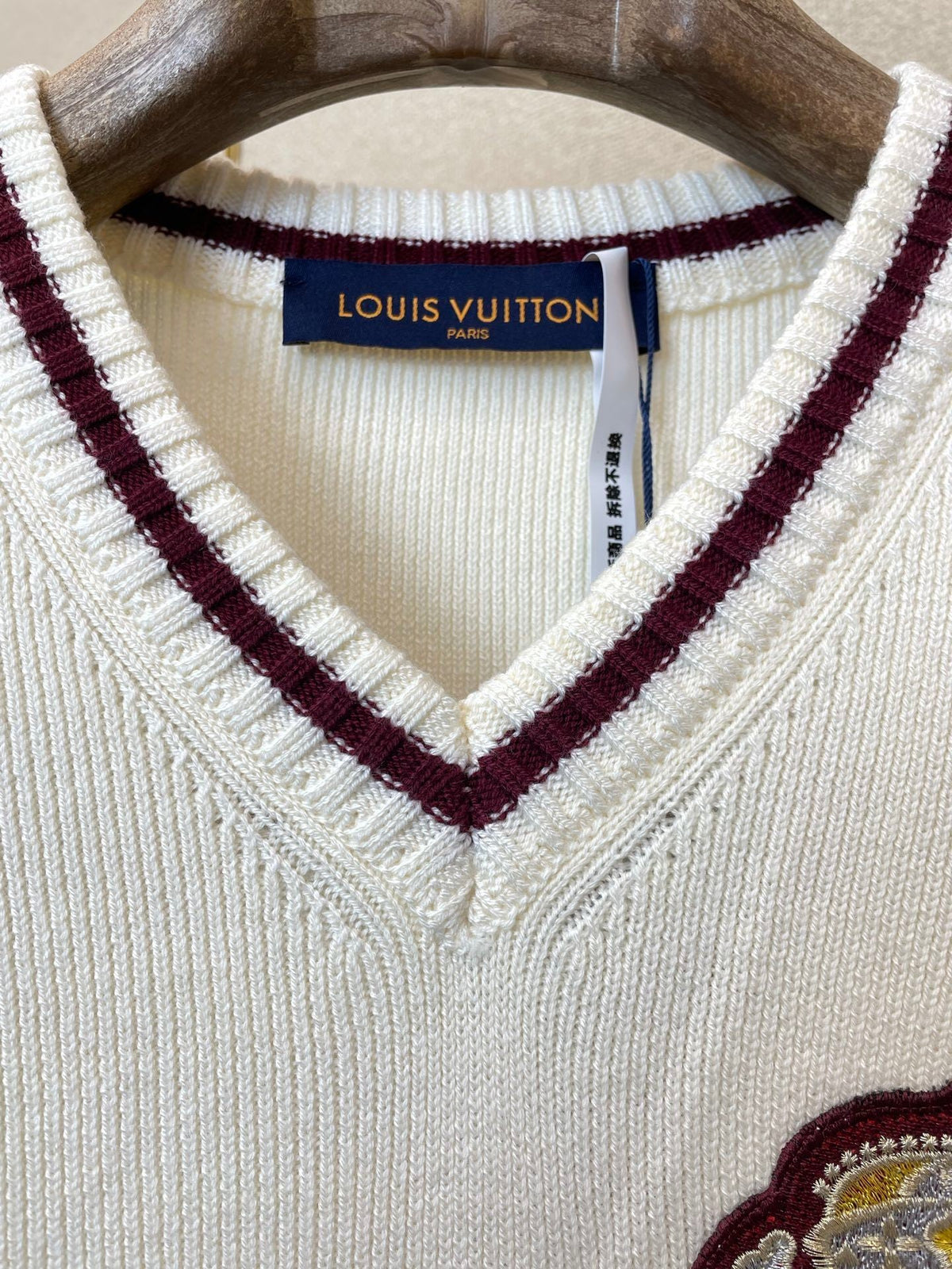 V-NECK KNIT VEST WITH EMBROIDERED CREST