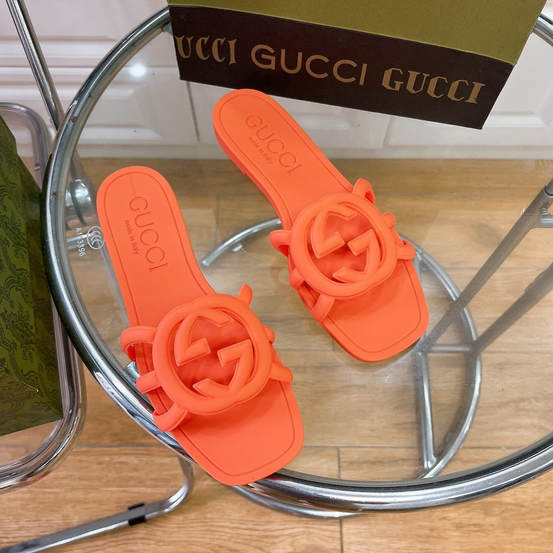 NEON ORANGE RUBBER SLIDE SANDALS WITH ROUND EMBLEM