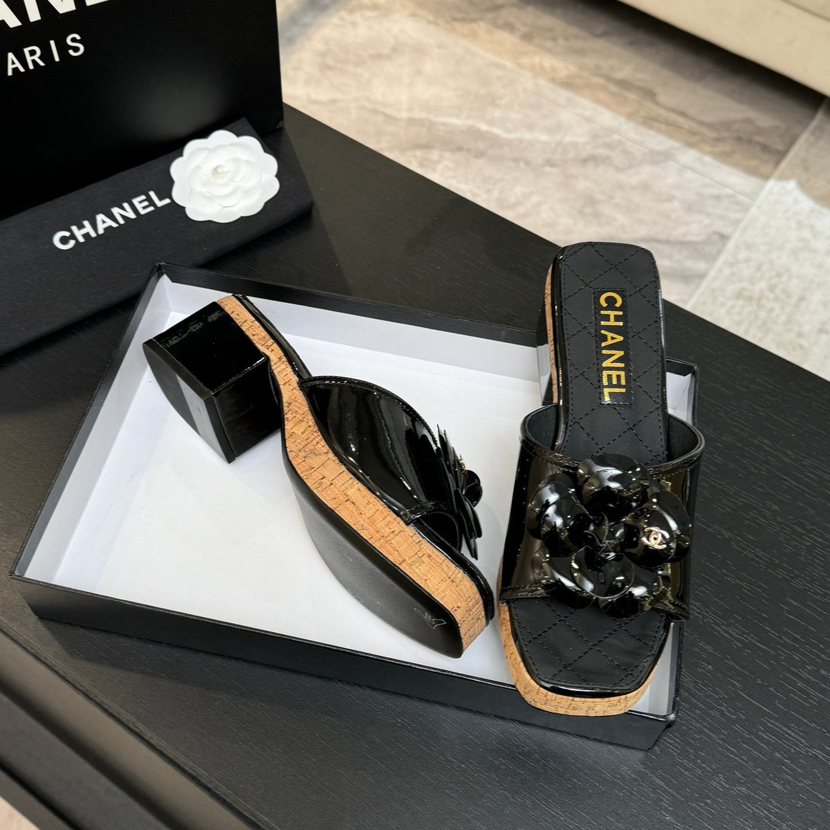BLACK QUILTED PLATFORM SLIDE SANDALS WITH FLORAL DETAIL