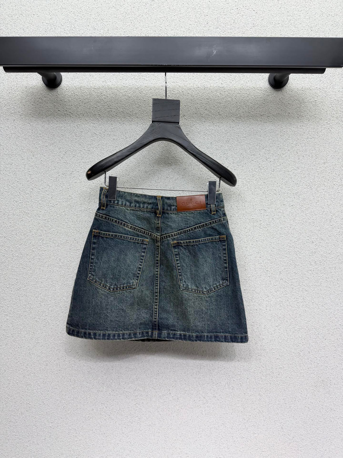 DARK BLUE DENIM MINI SKIRT WITH METAL DETAIL