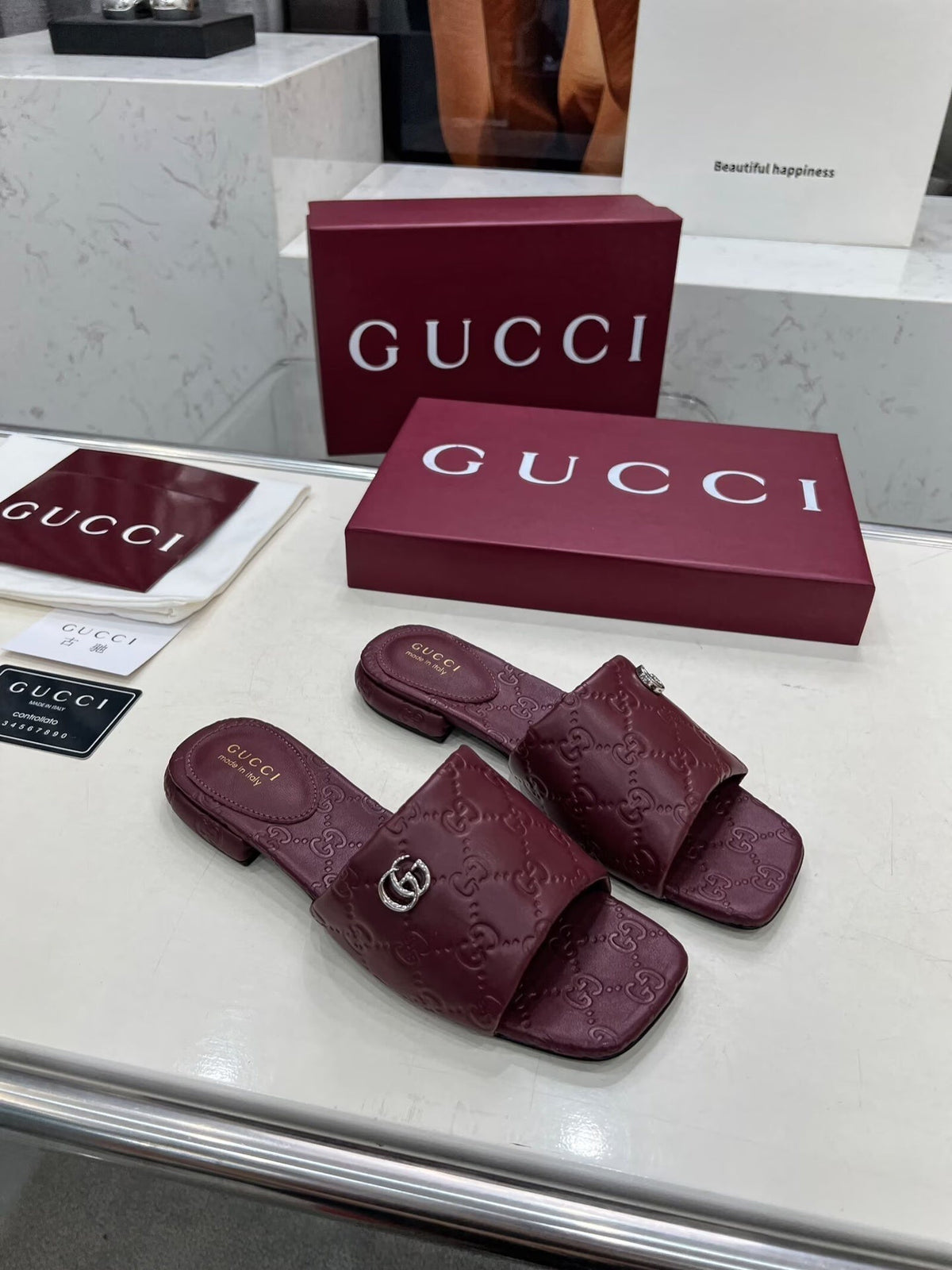 BURGUNDY EMBOSSED LOGO SLIDE SANDALS WITH METAL DETAIL