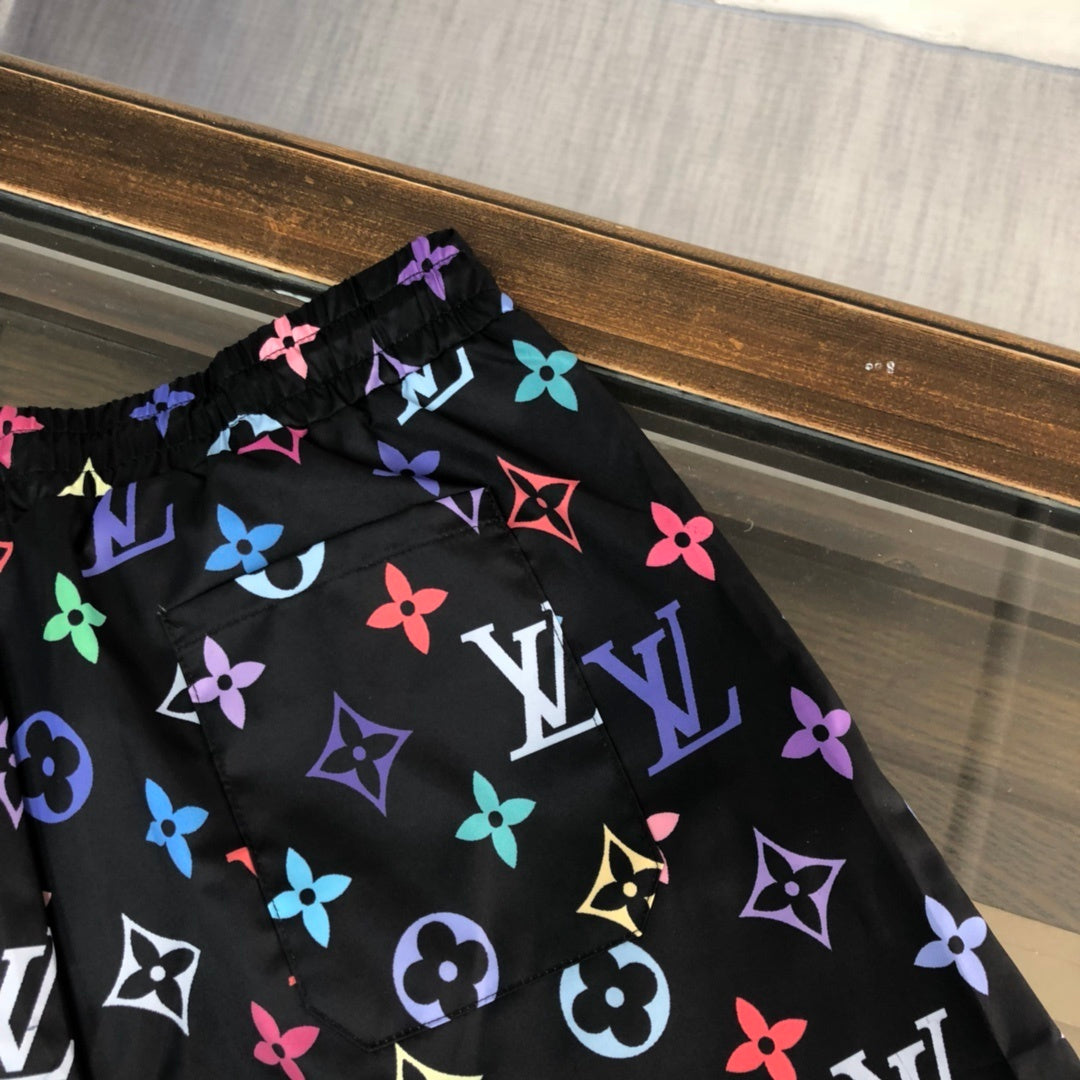 BLACK MULTICOLOR PRINT SWIM SHORTS