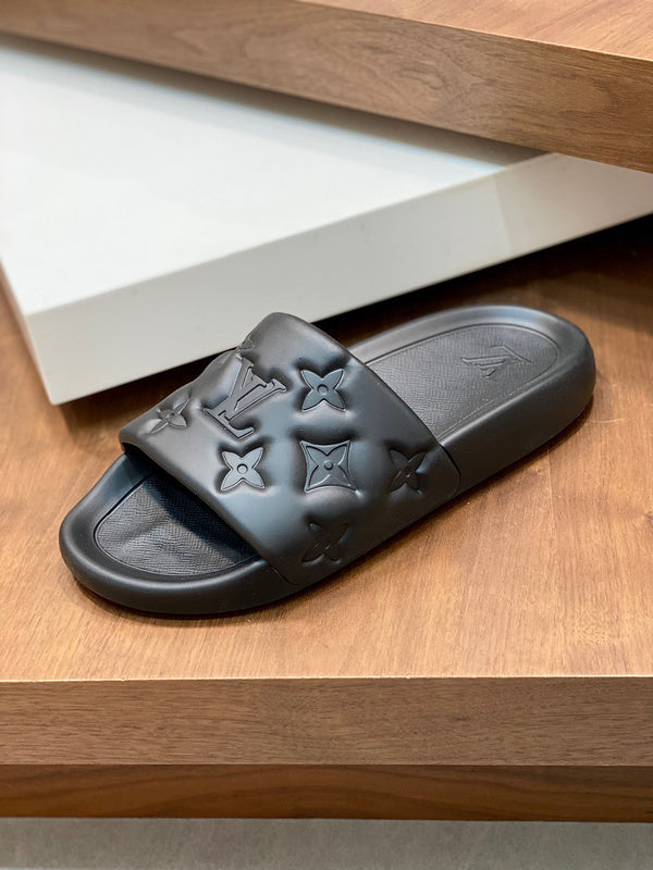 BLACK EMBOSSED MONOGRAM RUBBER SLIDE SANDALS