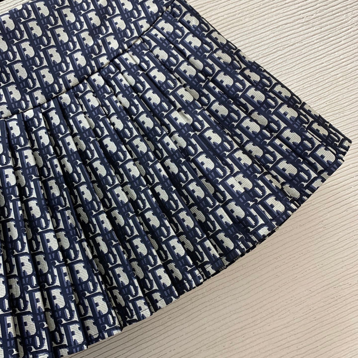 BLUE MONOGRAM PLEATED MINI SKIRT
