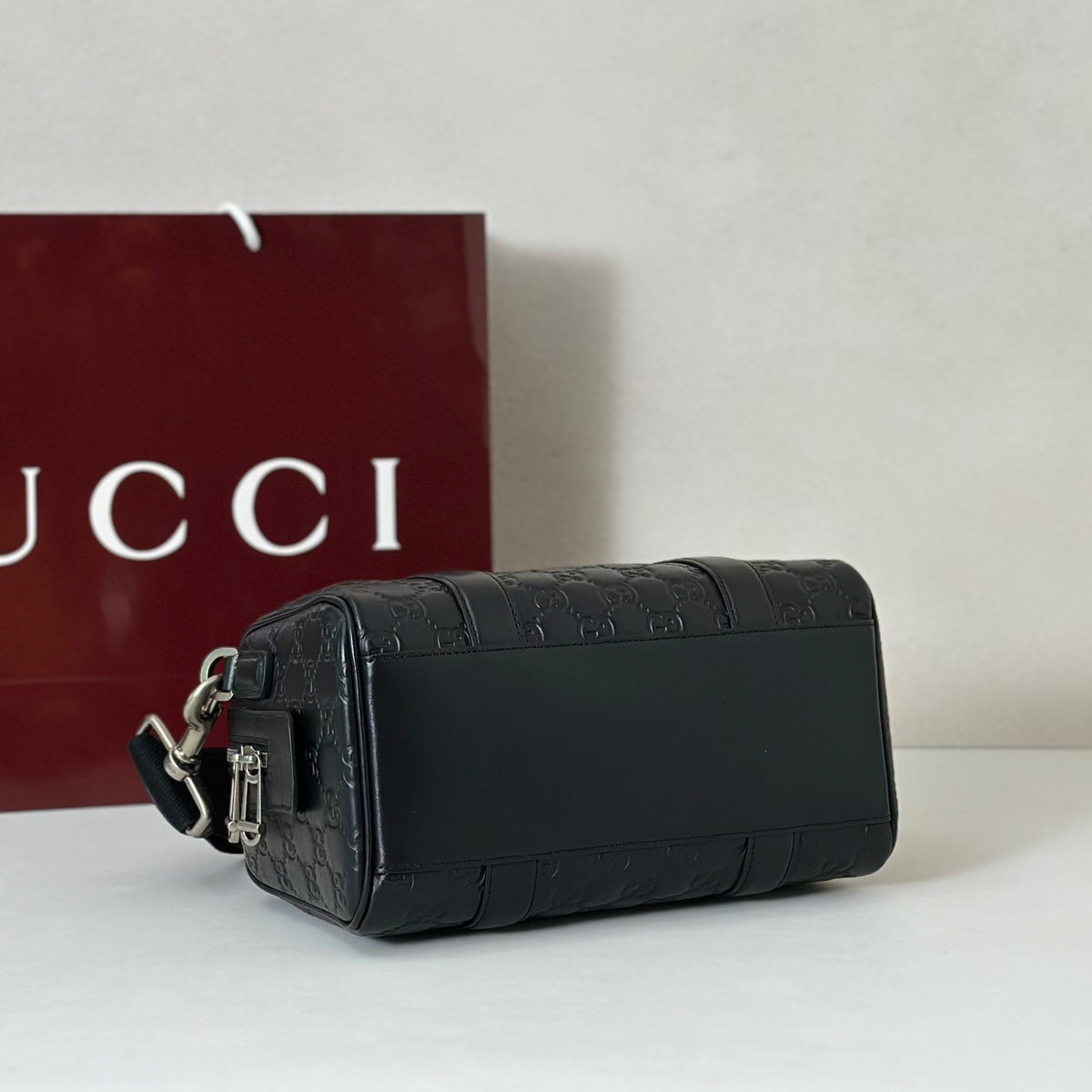 EMBOSSED LEATHER TOP HANDLE BAG