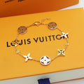 GOLD-TONE MULTI CHARM FLOWER MOTIF BRACELET