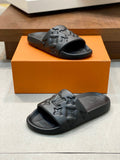 BLACK EMBOSSED MONOGRAM RUBBER SLIDE SANDALS