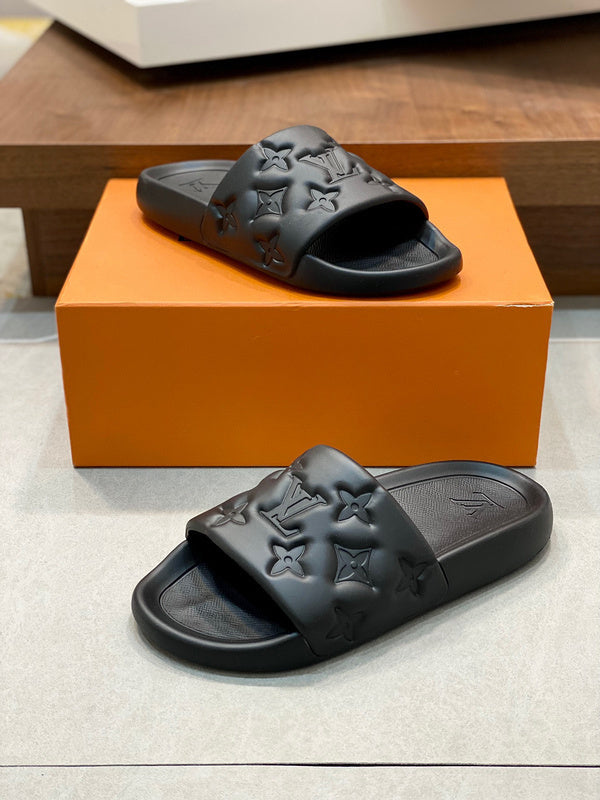 BLACK EMBOSSED MONOGRAM RUBBER SLIDE SANDALS