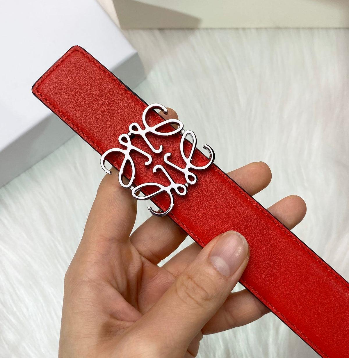 RED LEATHER BELT WITH SILVER ANAGRAM BUCKLE