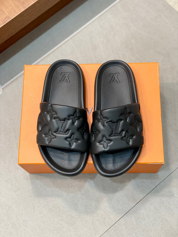 BLACK EMBOSSED MONOGRAM RUBBER SLIDE SANDALS