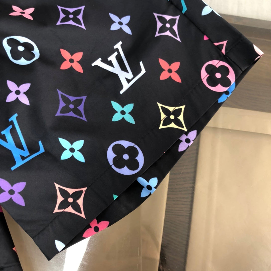 BLACK MULTICOLOR PRINT SWIM SHORTS