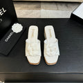 IVORY QUILTED PLATFORM SLIDE SANDALS WITH CAMELLIA DETAIL