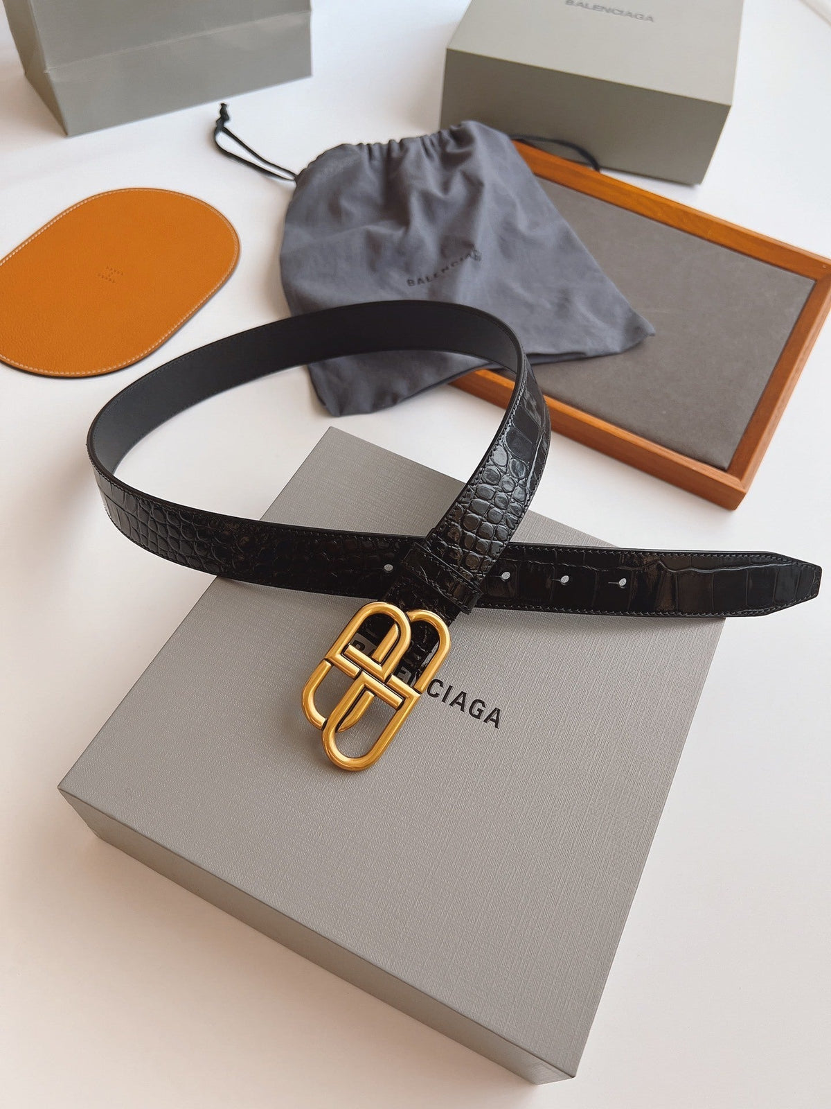 EMBOSSED BLACK LEATHER BELT WITH GOLD-TONE LOGO BUCKLE
